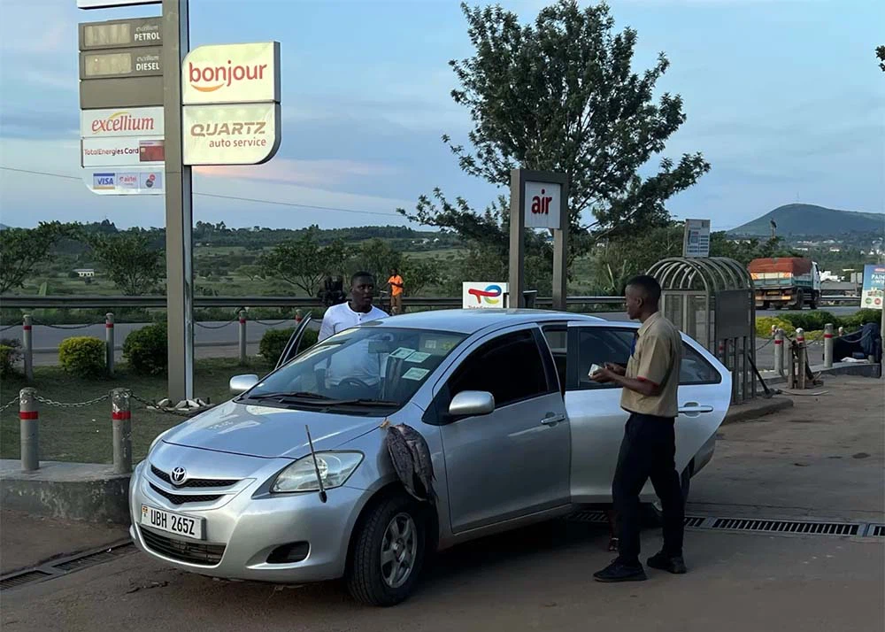 5 Filling up the tank and avoiding fish scents at a Total Gas station in Uganda